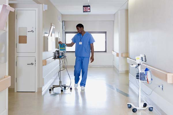Medical staff in a hospital corridor - temperature monitoring