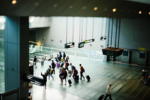passengers walking in hallway - smart airport